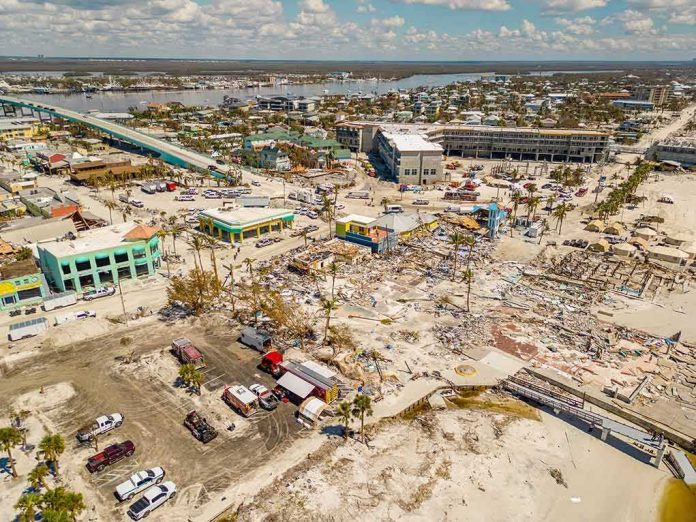 shutterstock_2208987255 Aerial view of coastal town with widespread storm damage