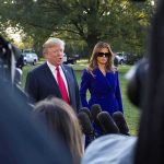 Israeli Intel Flags New Trump Threat Two adults speak to reporters outdoors with microphones in foreground