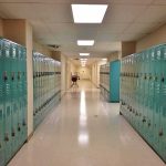 Hidden Camera Horror Inside Boys’ Locker Room School hallway with rows of teal lockers