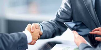 Risky AI Incidents Trigger New Hotline Businesspeople handshake at meeting table