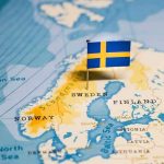 Sweden on a map with a small Swedish flag pin