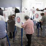 Fraud Verdict Shakes Quiet California Town Voters fill out ballots at polling booths in a busy voting room