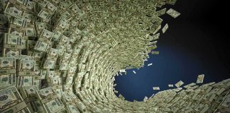 Tornado of US dollar bills swirling into a vortex