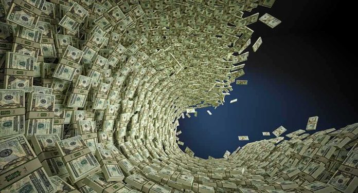 Tornado of US dollar bills swirling into a vortex