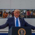 Trump’s Hollywood Ultimatum Hits Congress Donald Trump speaks at a podium with arms outstretched