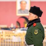 Xi & Putin’s Show of Force – Should America Worry? uniformed guard in green coat and fur hat standing in profile outdoors