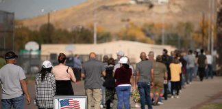 Crushing Defeat Upends New Generation Pitch voters standing in a long line outside a polling place