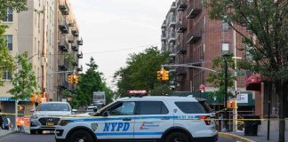All-Black Shooter Vanishes Near Queens Park NYPD police SUV blocking a city street at a taped-off scene