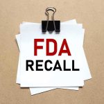 FDA’s Highest Alert: Are These in Your Freezer? Binder clip holding stacked papers labeled FDA recall