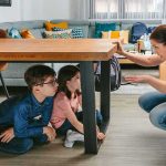 Poison Plot Exposes Agency Blindspots adult teaching two children to take cover under a table