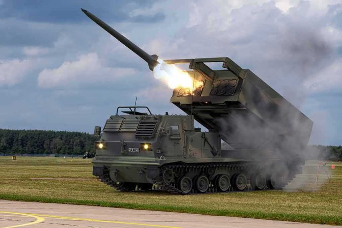 tracked rocket launcher firing missile on open field