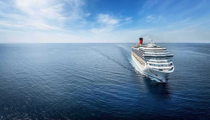 Cruise ship sailing on calm blue ocean