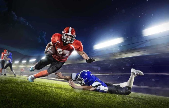 American football running back evades a tackle at night