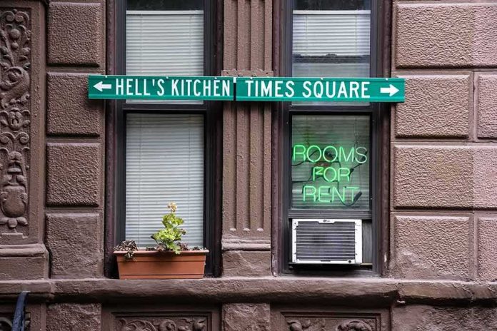 shutterstock_404250745 Apartment facade with windows, neon sign, and street direction sign