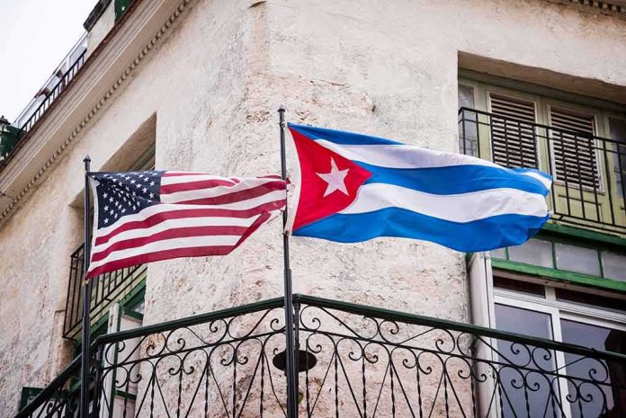 American and Cuban flags on a wrought-iron balcony