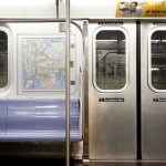 Caught on Video: Jewish Woman Choked, Hair Ripped Out on NYC Subway Subway car interior with stainless doors and empty blue bench