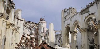 Festival Fireball Near Church Kills Dozens Interior view of a destroyed building with collapsed arches and debris