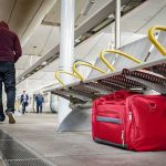 Foreign Suspects Dominate Paris Trains Red duffel bag on a station platform