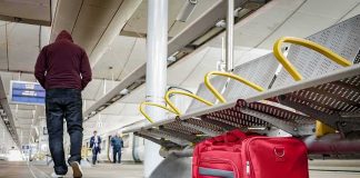 Foreign Suspects Dominate Paris Trains Red duffel bag on a station platform