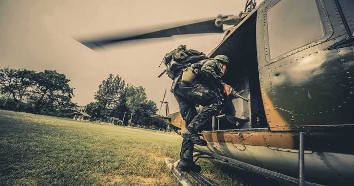 Soldier boarding a helicopter during field operation