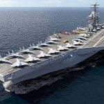 A Navy Carrier Stayed at Sea for Nearly 10 Months Aircraft carrier at sea with fighter jets on deck