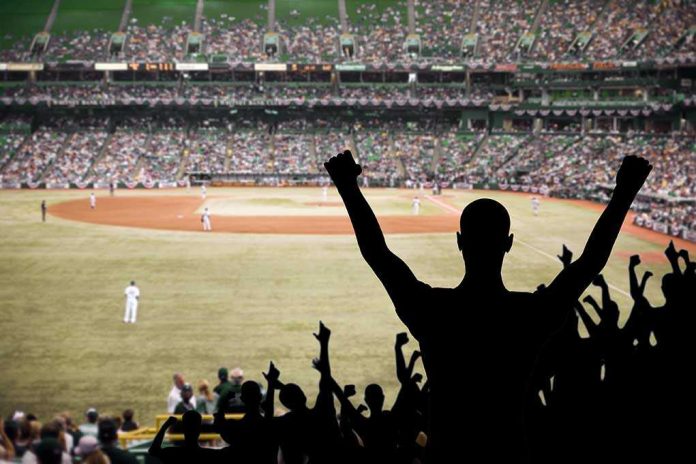 shutterstock_97905992 Crowd of fans cheering at a baseball game in a stadium