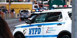 Jewish Man Stabbed in Manhattan’s Diamond District NYPD police car on a city street scene.