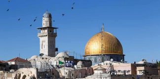 Dome of the Rock and minaret over Old City stone buildings