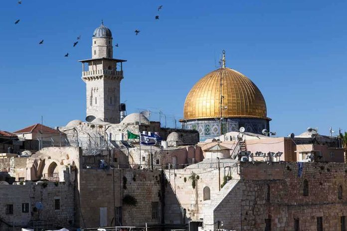 Dome of the Rock and minaret over Old City stone buildings