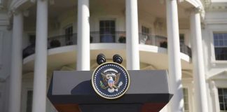Trump Pauses Sanctions, Greenlights Russian Diesel Presidential podium with seal in front of white-columned building