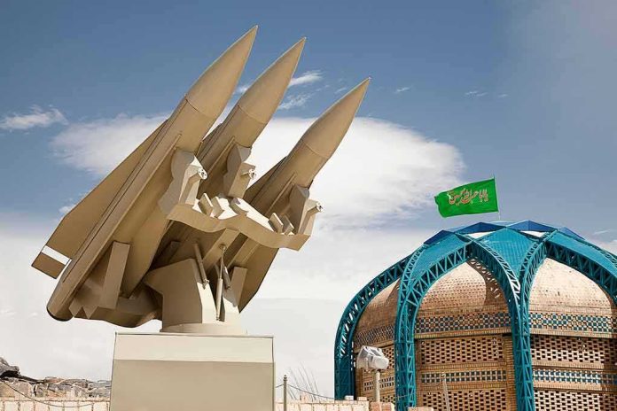shutterstock_1061545331 missile launcher beside domed building with green flag