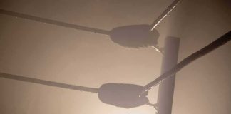 Wrestling Legend Hospitalized After Sudden Fall Boxing ring corner ropes in hazy light