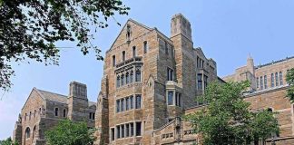 $800M Reckoning – The List Drops Soon Historic university building with stone facade and surrounding trees