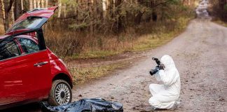 Grisly Discovery Blows Up ICE Abduction Tale forensic investigator photographing evidence near red car on dirt road