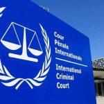 ICC Power Grab Backfires – Sanctions Bite International Criminal Court sign with scales emblem outside modern building