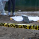 Grandmother and Aunt Found Dead in Home Police crime scene with yellow tape and forensic team