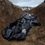 They Waited Years To Bury Their Dead Body bags in a mass grave trench