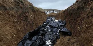 They Waited Years To Bury Their Dead Body bags in a mass grave trench