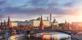 Preemptive Strikes: NATO Hubs in Crosshairs Kremlin complex by a river at sunset