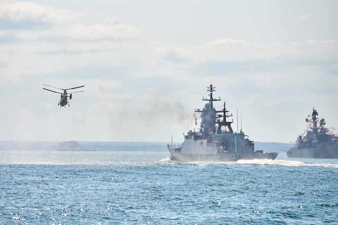 shutterstock_2060995196-1 military ships and helicopter at sea