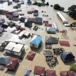 Bangkok Briefly SANK – Then Worse News Aerial view of flooded residential neighborhood