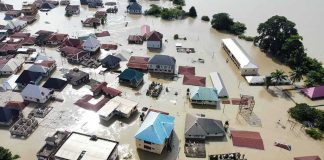 Bangkok Briefly SANK – Then Worse News Aerial view of flooded residential neighborhood
