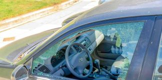 Ex-Cop Charged After Commuter Shot Dead Car with shattered driver-side window