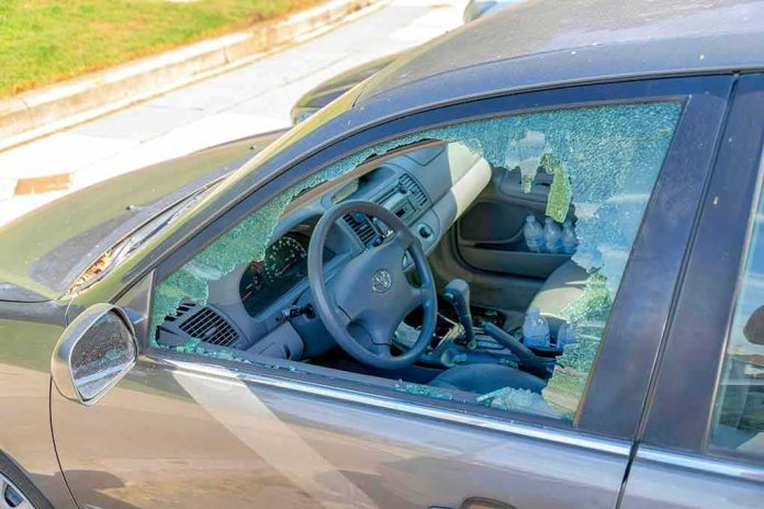 shutterstock_2267097861-1 Car with shattered driver-side window