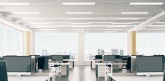 Microsoft’s Quiet 60,000-Person Shakeout Open-plan office with rows of desks and monitors