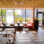 Seattle Gamble Backfires – Drivers Stalled Fast-food restaurant interior with self-order kiosk and seating