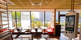 Seattle Gamble Backfires – Drivers Stalled Fast-food restaurant interior with self-order kiosk and seating