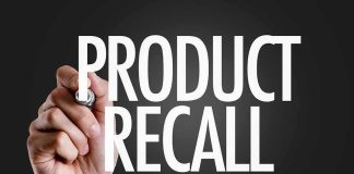 Fire Risk Triggers Recall of 77,000 Hand Warmers Hand writing product recall on dark background