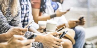 Apple’s New Age Gate Sparks Parental Power Group of people sitting and using smartphones